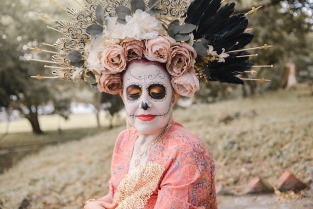 Portrait of Mexican woman made up as a catrina