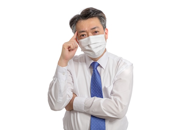 Portrait of a middle-aged Asian businessman wearing a white face mask.