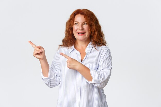 Portrait of middle aged redhead woman posing