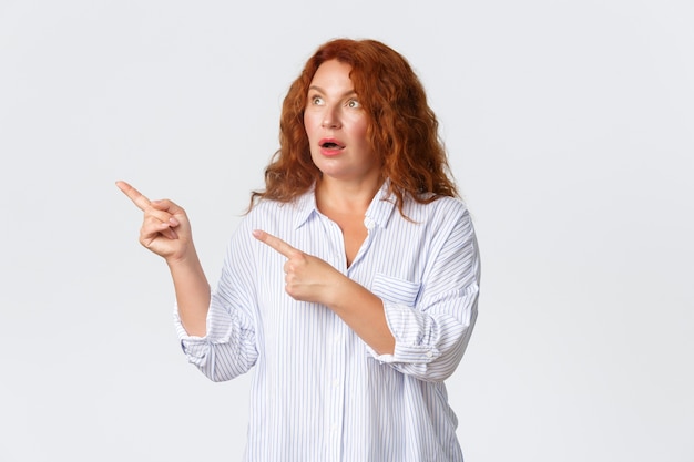 Portrait of middle aged redhead woman posing