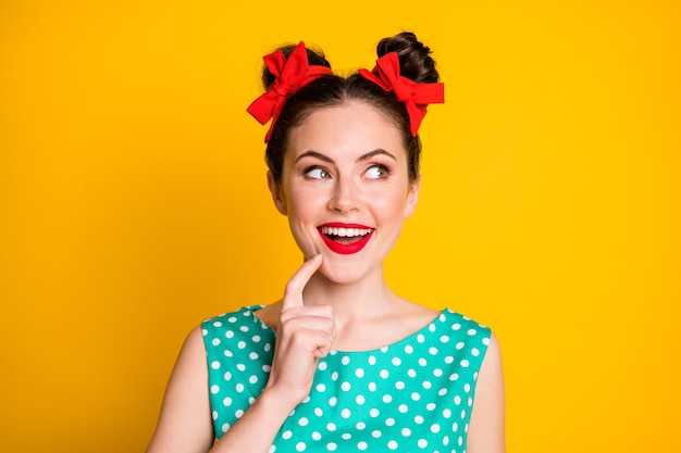 Portrait of minded girl look copyspace touch chin finger think wear skirt isolated over bright color background