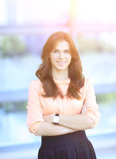 Portrait of modern young woman on blurred office background.photo with copy space