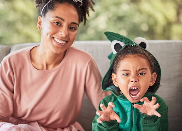 Portrait of mother and child playing having fun with costume and bonding on a sofa at home Fantasy game and creative parent enjoying a playful activity with her daughter smile and relax together