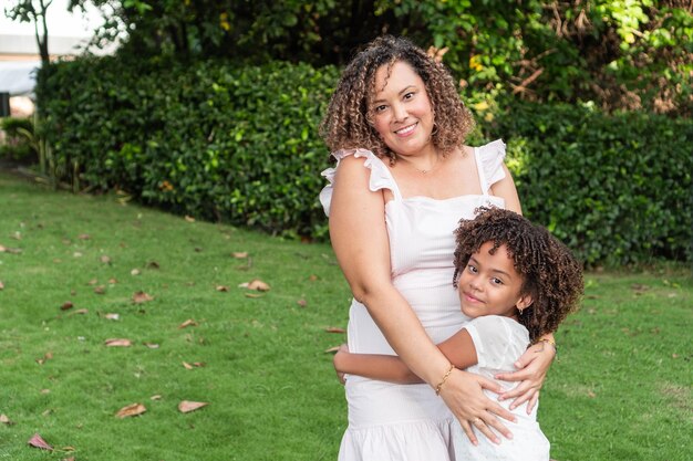 Portrait of a mother and daughter spending time together outdoors