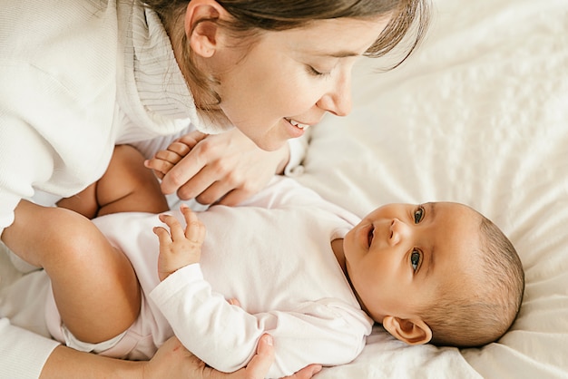 Portrait of a mother with her baby at home.