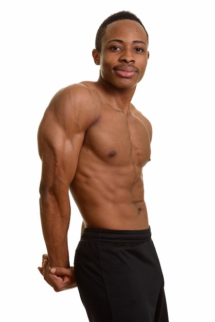 Portrait of muscular African man showing triceps muscles