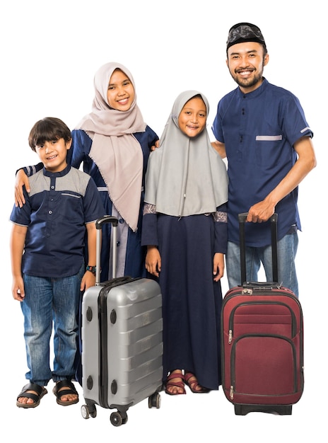 Portrait of muslim asian family with suitcase going for eid mubarak holiday