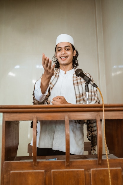 Portrait of muslim male preacher speech sharing about islam during prayer time in the mosque