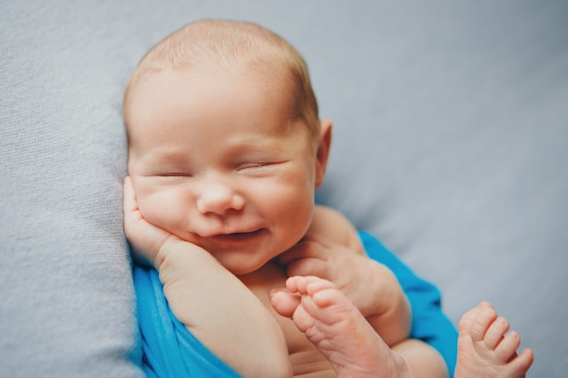 Portrait of newborn baby on a white background.