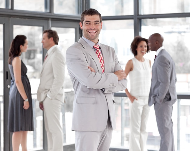 Portrait of a nice businessman with his team