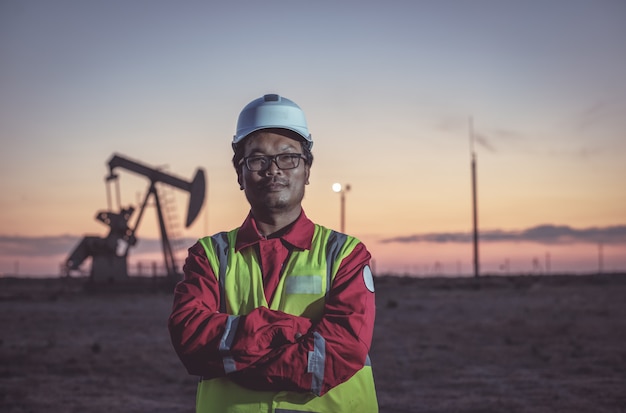 Portrait of an oil worker on a field