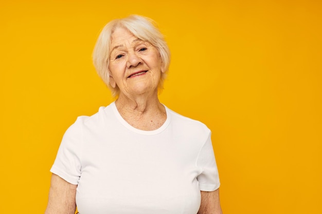 Portrait of an old friendly woman happy lifestyle joy isolated background