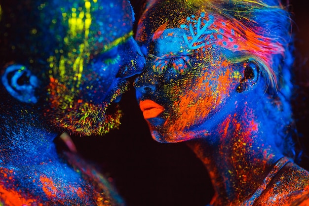 Portrait of a pair of lovers painted in fluorescent powder.