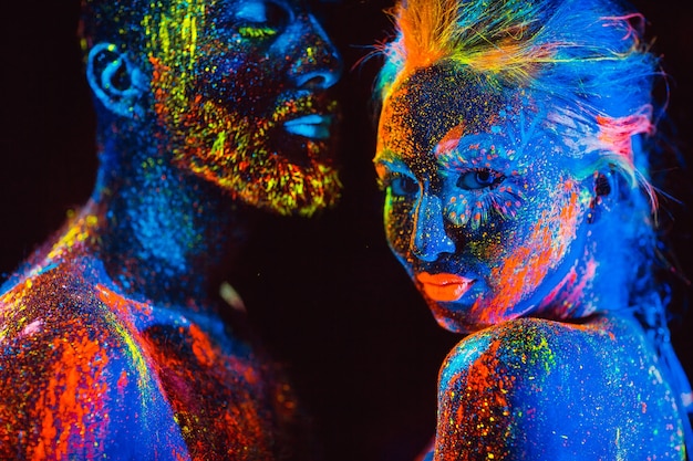 Portrait of a pair of lovers painted in fluorescent powder.