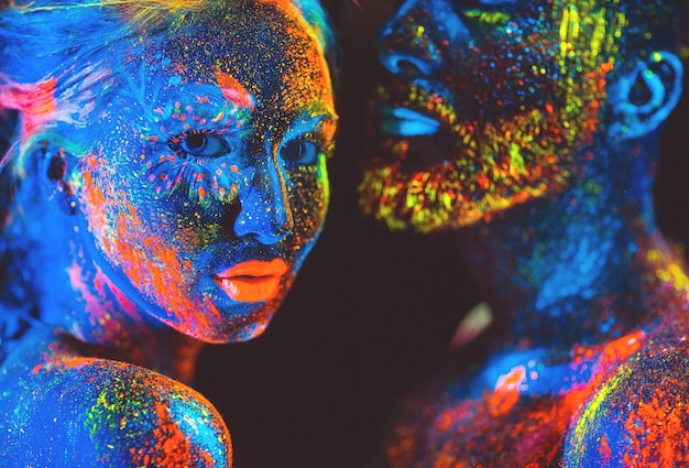 Portrait of a pair of lovers painted in fluorescent powder.