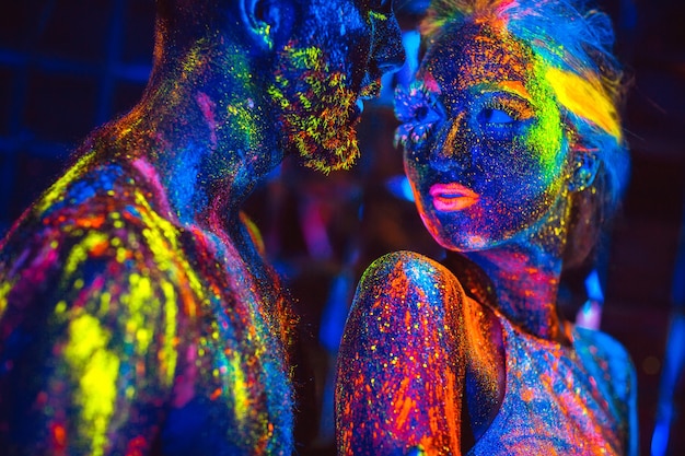 Portrait of a pair of lovers painted in fluorescent powder.