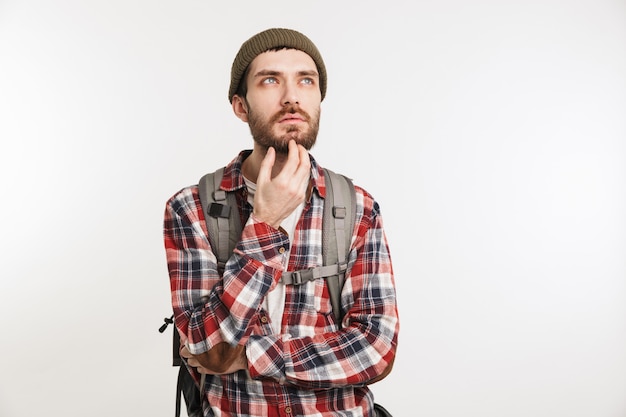 Portrait of a pensive bearded man in plaid shirt