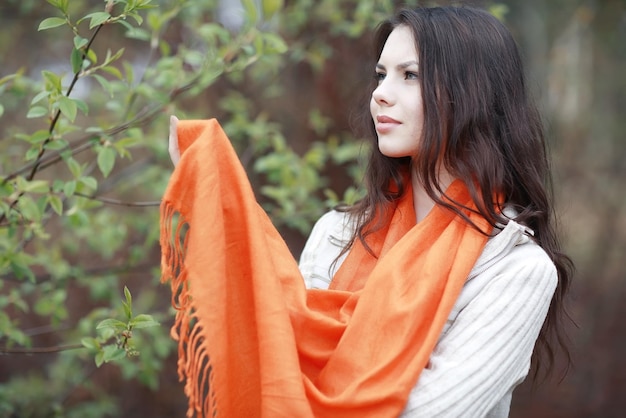 portrait of a pensive girl in park