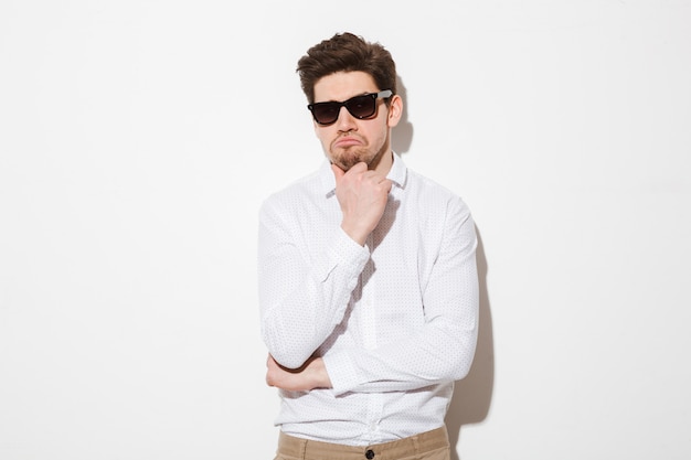 Portrait of a pensive young man dressed in shirt