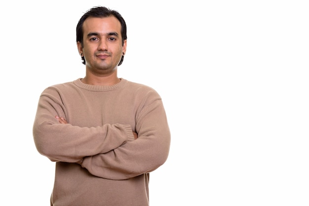 Portrait of Persian man wearing sweater with arms crossed