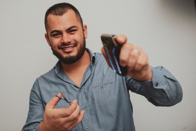 Portrait photo of a crazy hairdresser isolated on a white background High quality photo