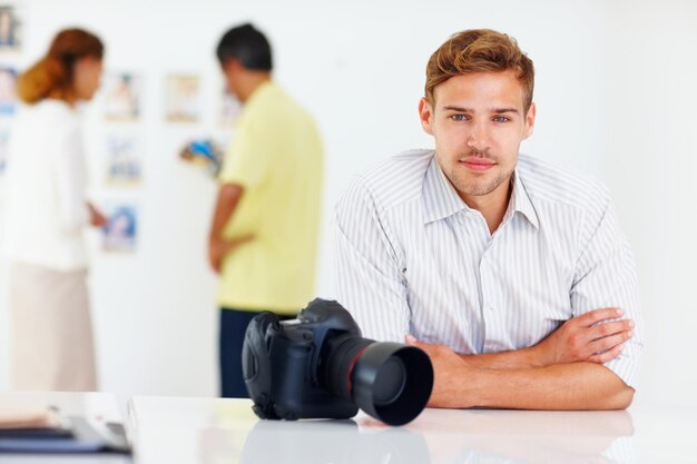 Photo portrait photographer and man with camera creative and arms crossed in office confident and journalist proud reporter and excited for internship in newsroom happy and storytelling of person