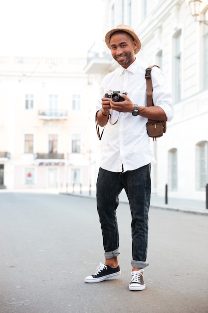 Portrait of photographer on the street with camera