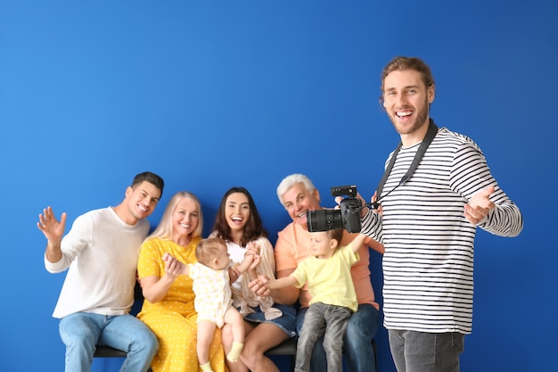 Portrait of photographer working with family in studio