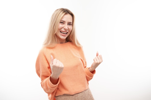 Portrait positive blonde girl emotionally rejoices and feels happy satisfied isolated on white background advertising banner