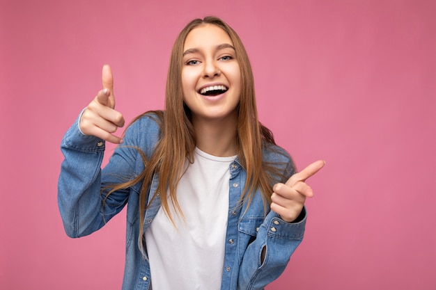 Portrait of positive happy joyful young beautiful nice dark blond woman with sincere emotions