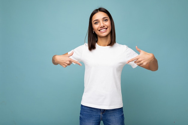 Portrait of positive happy smiling young beautiful brunette woman with sincere emotions wearing