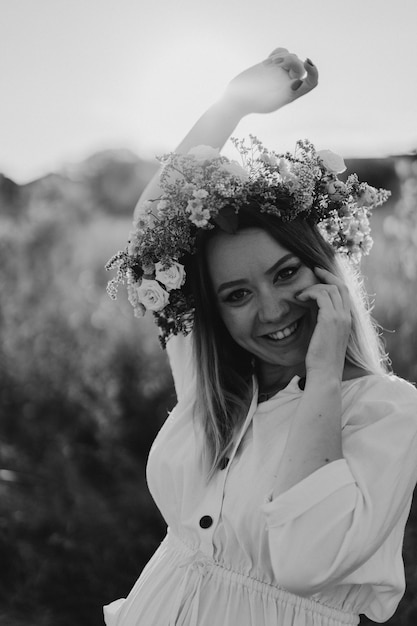 Portrait of a pregnant woman a beautiful young pregnant woman in a white dress walks in the field