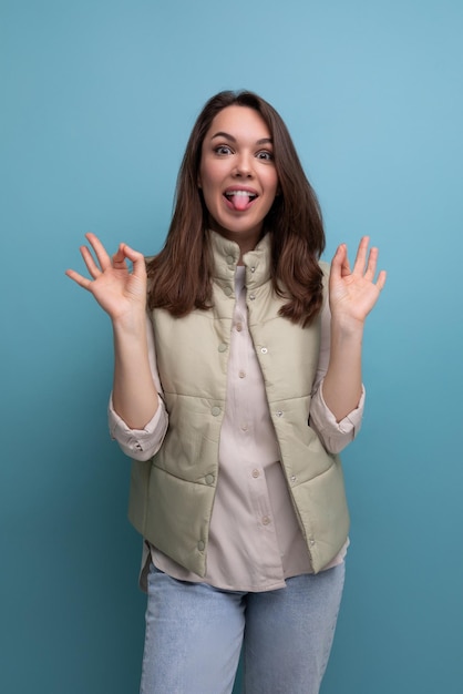 Portrait of pretty brunette young woman with grimace