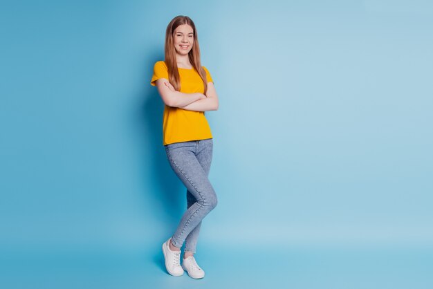 Portrait of pretty confident lady crossed hands wear casual clothes on blue background