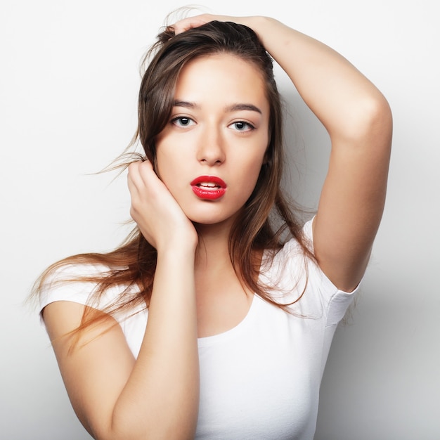 Portrait of a pretty girl  on a white background