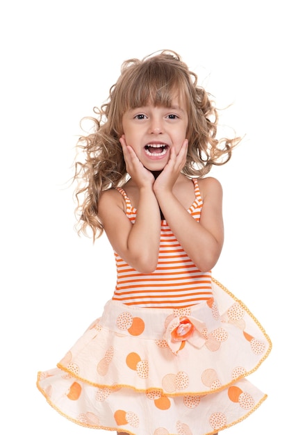 Portrait of a pretty little girl in dress on white background