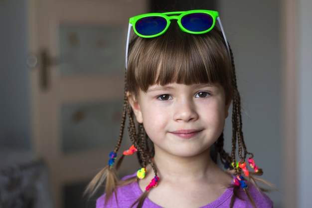 Portrait of pretty little girl with small braids