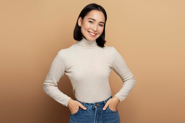 Portrait of pretty smiling happy woman looking at camera with cute positive face