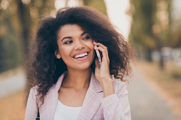 Portrait of a pretty young woman in the park