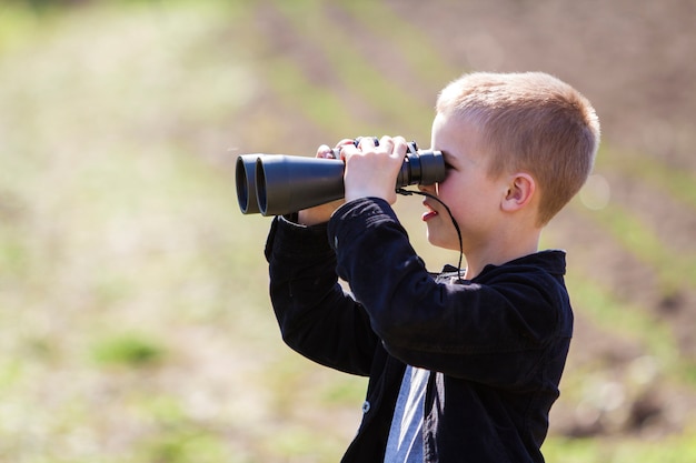 Portrait in profile of little handsome cute blond boy