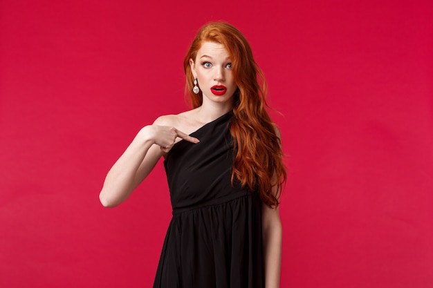 Portrait of a redhead woman in black dress