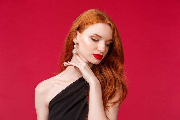 Portrait of a redhead woman in black dress