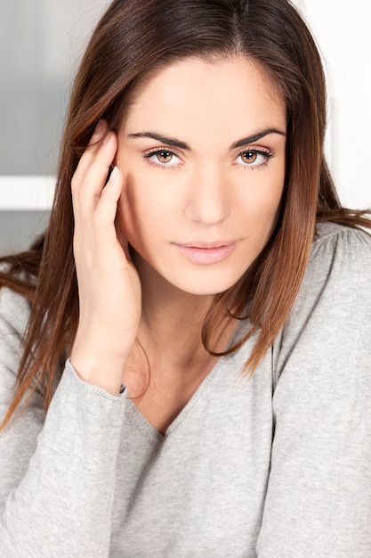 Portrait relaxed young woman at home