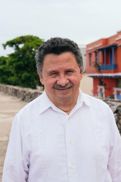 Portrait of retired latino man in the street