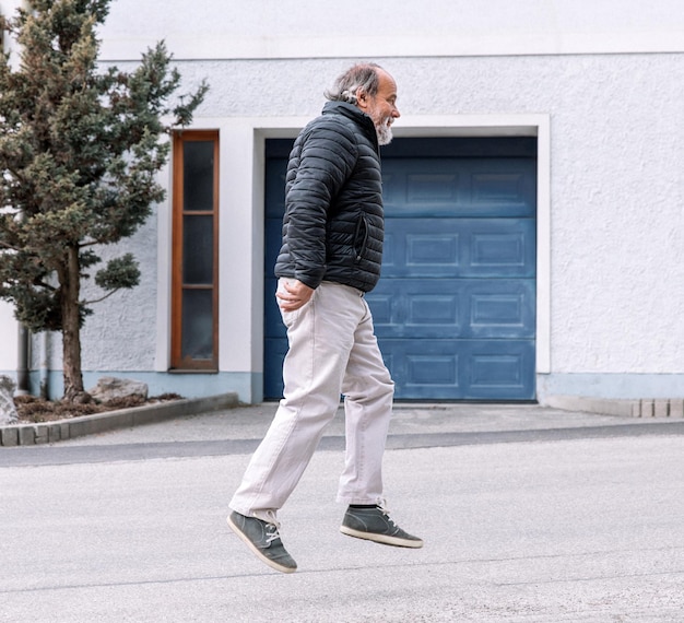 Portrait of a running mature man in a small town senior activities