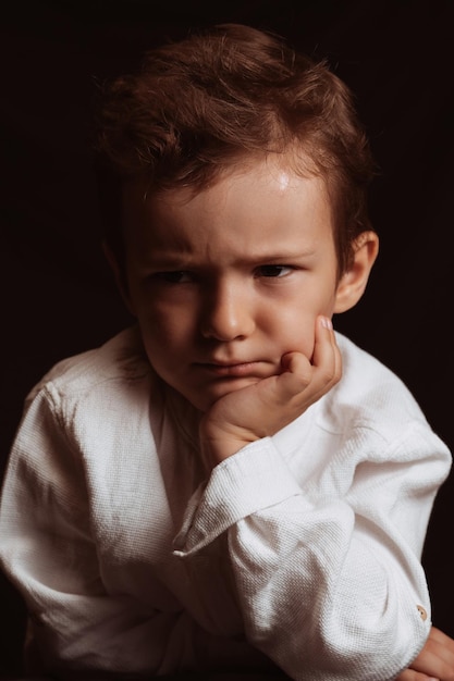 portrait of a sad angry child a preschooler boy