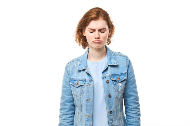 Photo portrait sad redhaired young woman isolated on white studio background made mistake upset and depressed face