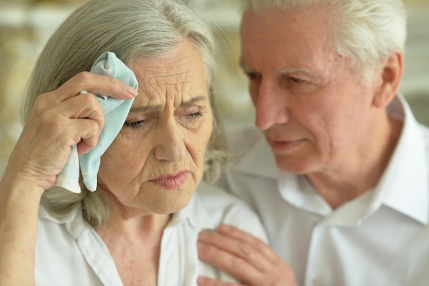 Portrait of sad senior couple