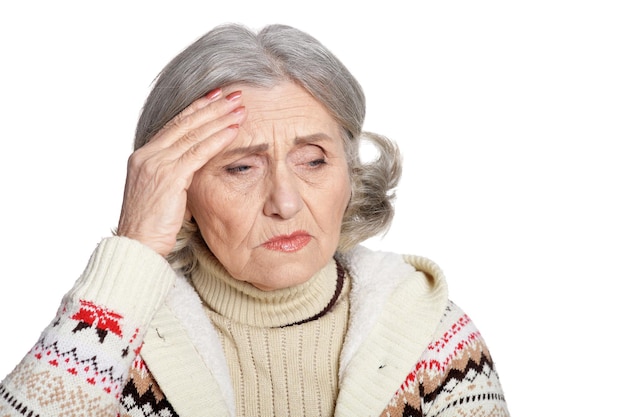 Portrait of a sad senior woman isolated