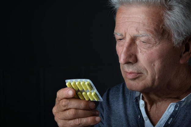 Portrait of sad sick senior man